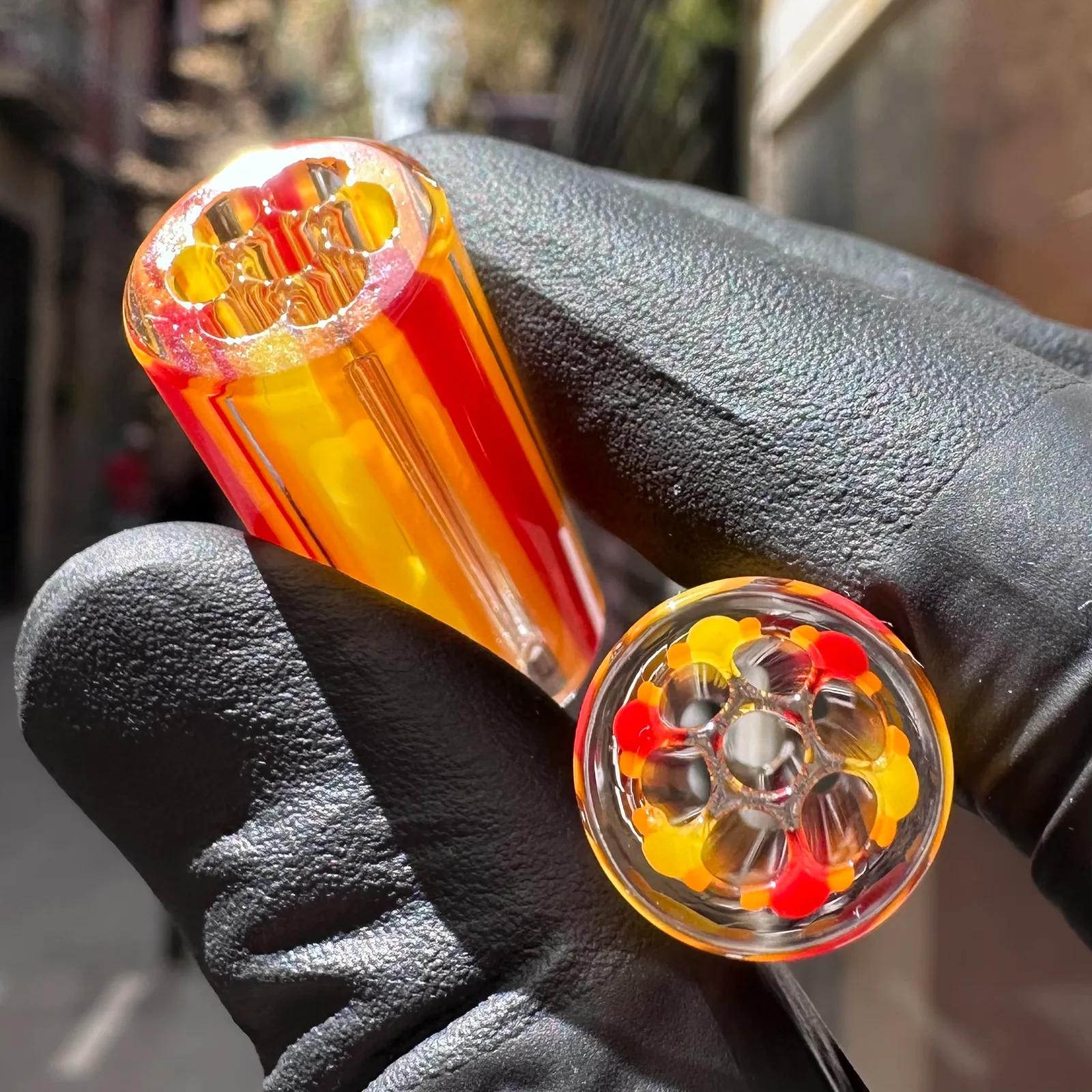 Close-up of Fire 1 borosilicate glass tips with bright red and orange pattern