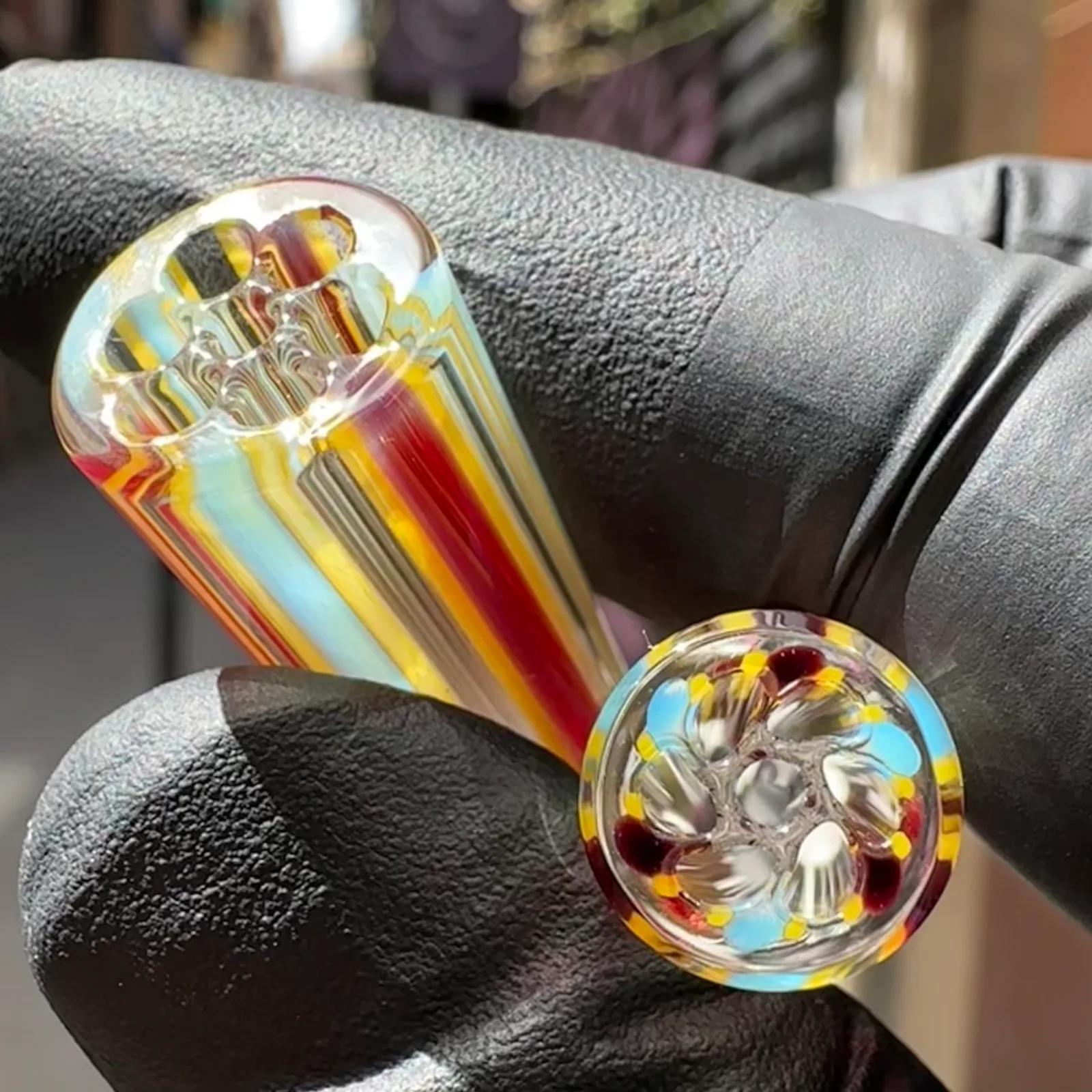 Triad Shift borosilicate glass tips shown in hand for size reference