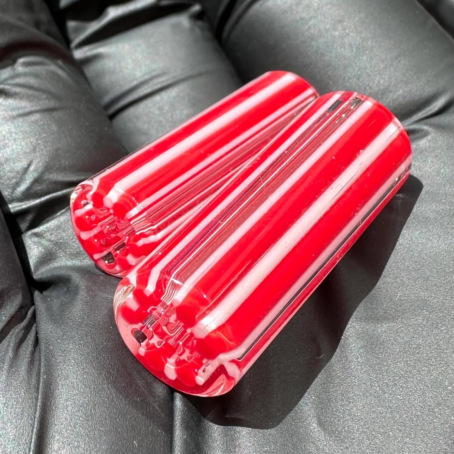 TriCore borosilicate glass tips shown in hand for size reference